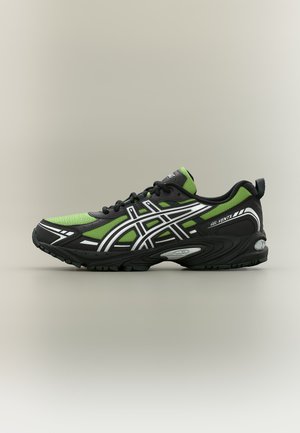 Green and black running shoe with white accents, lace-up design, GEL-VENTX branding on side, and textured sole for traction.