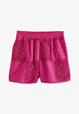Helle pinkfarbene Baumwollshorts mit elastischem Bund und Patchwork-Spitzenblumenmustern auf den Vorderseiten.
