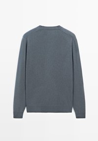 Gray, long-sleeve sweater made of soft fabric with a round neckline and ribbed cuffs. Smooth texture, no visible patterns or accents.