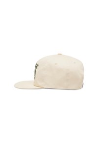 Casquette de baseball couleur crème en coton. Dotée d'un bord plat, d'une sangle ajustable et d'un imprimé graphique vert à l'avant.
