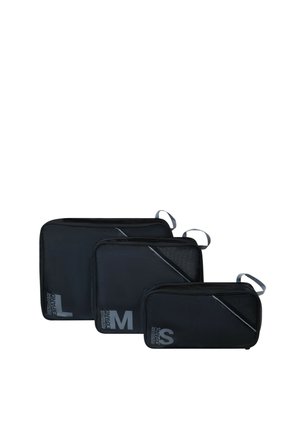 Three black rectangular packing cubes in large, medium, and small sizes, each with a carrying loop and size labels on the front.