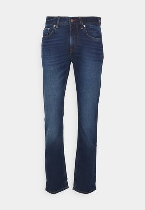 Dunkelblaue Jeans mit geradem Bein, vorderen Taschen, Knopfverschluss und dezenten Verblassungen an den Oberschenkeln vor weißem Hintergrund.