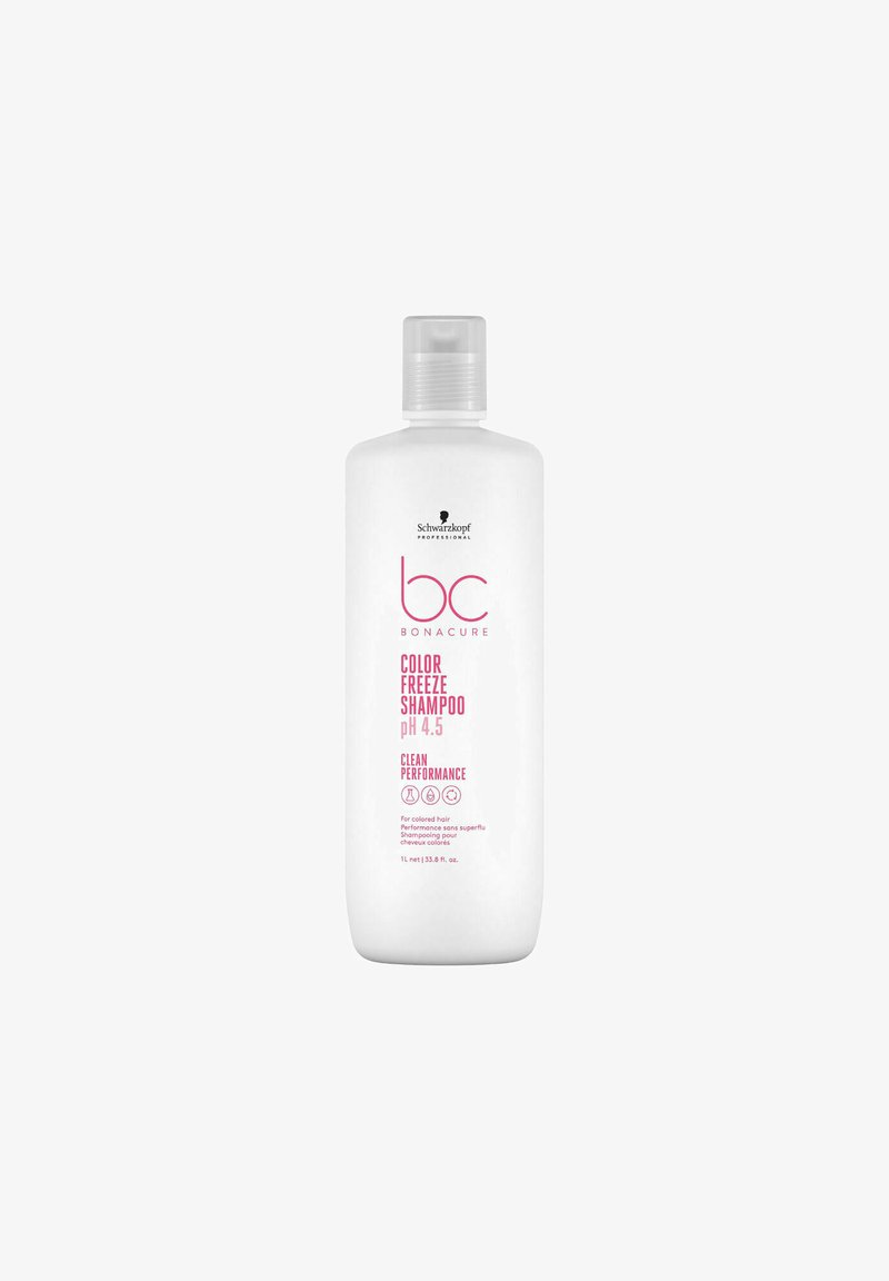 Bottiglia di plastica bianca di shampoo con tappo a ribalta. L'etichetta presenta un testo rosa con la dicitura "Shampoo Color Freeze pH 4.5" e il logo del marchio.