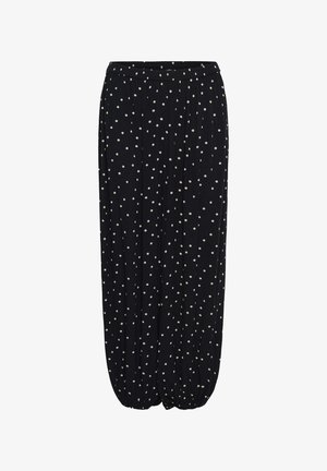 Fekete, bő szárú nadrág fehér pöttyökkel, gumírozott, összegyűrt szegélyekkel a bokánál.