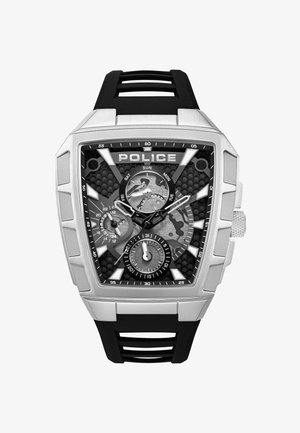 Orologio rettangolare tono argento con cinturino in gomma nera, dotato di un quadrante nero strutturato, tre sotto-quadranti e numeri delle ore bianchi in evidenza.
