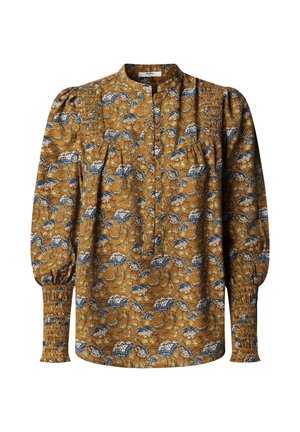 Bluse mit Blumenmuster in Senfgelb mit blauen und weißen Blumen. Verfügt über einen Mandarin-Kragen, Knopfleiste und geraffte Bündchen. Lange Ärmel.