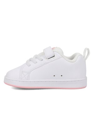 White children's sneaker with pink sole, fabric lining, laces, and a Velcro strap on the side, shown in profile.
