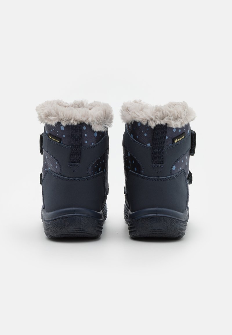 Navyblaue Stiefel mit Punktenmuster, gefälschter Fellfutter oben, verstellbare Riemen an den Seiten und strukturierten Gummisohlen.