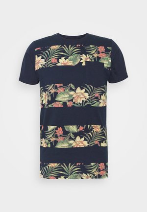 Navy blue short-sleeve t-shirt featuring a floral pattern with tropical leaves and flowers. Includes a small chest pocket, cotton material.