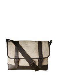 Canvas messenger bag in light beige with dark brown leather accents, adjustable strap, flap closure, and two front buckle details.