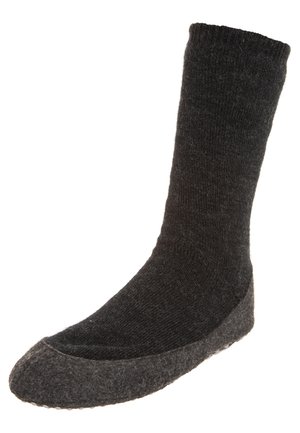Chaussette tricotée gris foncé avec une texture solide, présentant un fond en feutre gris renforcé pour plus de durabilité et de confort.