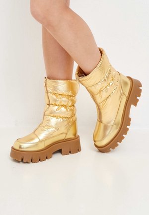 Bottes de neige - gold-coloured