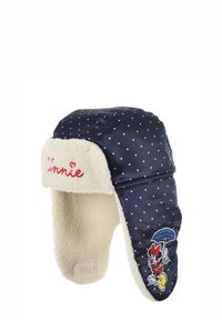 Navy blue winter hat with white polka dots, faux fur lining, ear flaps, and embroidered Minnie Mouse design holding an umbrella.