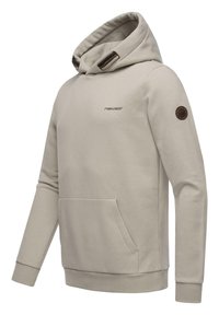 Lichtbeige hoodie gemaakt van zachte stof, met een voorzak, geribbelde boorden en een verstelbare capuchon met bruine accenten.