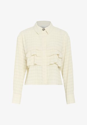 Kreemjas rümpadega nööbiga särk, millel on terav krae, pikad varrukad ja kaks rinna-taskut; tekstuuriga kangas, millel on peen ruuduline muster.