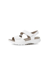 White open-toed sandals with adjustable straps, cushioned insole, and a textured rubber sole for grip and comfort.