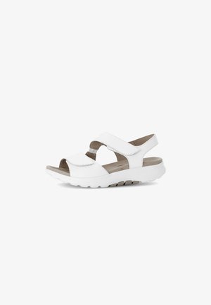 Weiße Sandalen mit offenen Zehen, verstellbaren Riemen, gepolstertem Fußbett und einer strukturierten Gummisohle für Grip und Komfort.