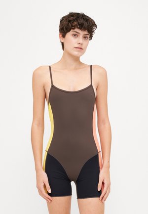 Brown swimsuit featuring thin shoulder straps, color-blocked sides in yellow, pink, and black, with a fitted design and short leg length.