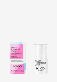 Contenitore trasparente di plastica con base bianca, etichettato "Smart Hydra Shot Stick" in nero. Il packaging in cartone colorato presenta accenti rosa e blu.