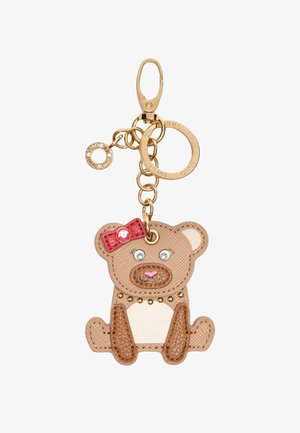 Portachiavi a forma di orso realizzato in pelle sintetica testurizzata, con una chiusura dorata, un accento di fiocco rosso e dettagli come occhi e borchie.