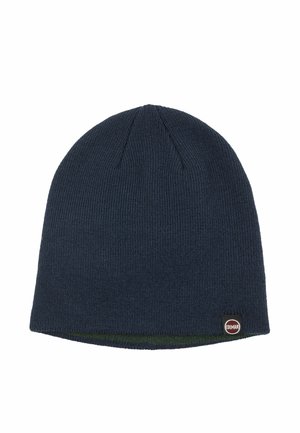 Berretto di maglia blu navy con una piccola toppa rotonda con il logo Colmar vicino al bordo inferiore.