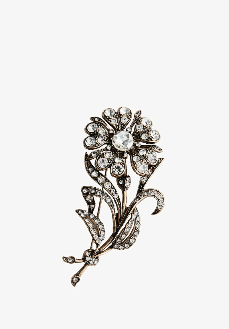 Broche fleur en métal ornée de cristaux clairs sur les pétales, les feuilles et la tige, avec un grand cristal central.