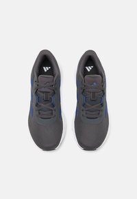 Athletic shoes with a gray mesh upper, blue detailing, and white soles. Features a padded collar and lace-up closure with textured accents.