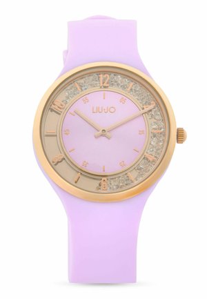 Orologio da polso con cinturino in silicone lilla, cassa rotonda color oro, decorazioni in cristallo e indici e lancette color oro, marca Liu Jo.