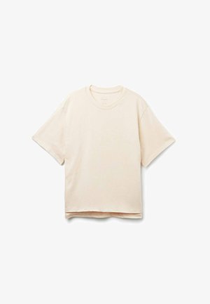 T-shirt corto color crema in tessuto morbido, con scollatura rotonda, vestibilità rilassata e orlo dritto con dettagli di cucitura minimi.