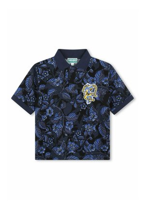 Polo shirt bleu marine avec un motif floral dans des nuances de bleu. Il possède un col classique et un logo brodé sur la poitrine. Manches courtes.