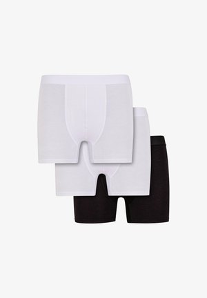 Tre paia di boxer in bianco e nero. Realizzati in tessuto morbido, con una cintura elastica e un taglio classico.