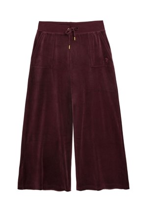 Weit geschnittene, bordeauxrote Samthose mit elastischem Bund, Kordelzug und zwei vorderen aufgesetzten Taschen.