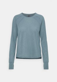 Langärmliges Sporttop aus weichem, strukturiertem blauen Stoff. Mit Mesh-Details an den Schultern und einem abgerundeten Saum für Bewegungsfreiheit.