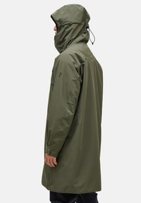 Olive green waterproof jacket with a hood, long sleeves, and adjustable drawstrings. Features a subtle logo on the left arm. Smooth texture.