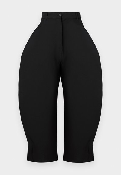 Black trousers featuring a high-waisted design with wide, tapered legs. Made from smooth fabric, with a button closure and no visible pockets.