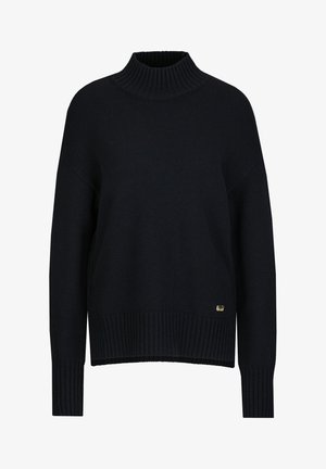 Navy knit sweater with a high ribbed collar, loose fit, and ribbed cuffs and hem. Features a small gold logo accent on the bottom left side.