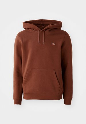 Brown cotton hoodie with a spacious front pocket, adjustable drawstring hood, and a small logo patch on the chest. Regular fit and ribbed cuffs.