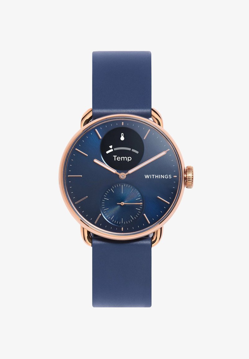 Smartwatch Withings con cassa in oro rosa, quadrante blu con display della temperatura e cinturino in silicone blu. Include un quadrante secondario per metriche aggiuntive.