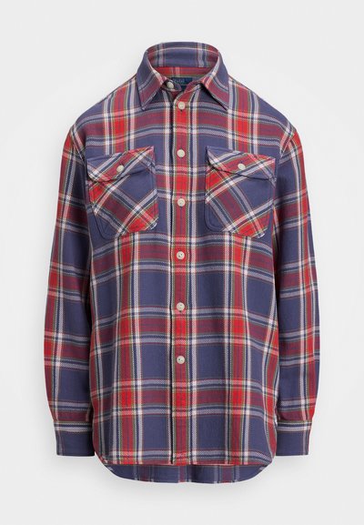 Navy plaid shirt with red and white accents, long sleeves, two chest pockets, and button-up front. Made from a soft, woven fabric.