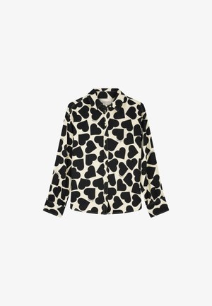 Long-sleeve shirt featuring a button-up front, crafted from fabric with a cream background and large black heart patterns.