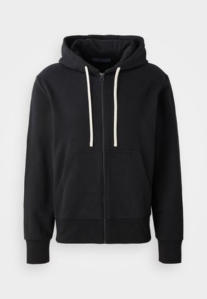 Hoodie noir zippé en mélange de coton, avec une poche avant, un cordon de serrage pour la capuche et des poignets en bord-côte. Texture lisse, design simple.