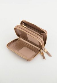 Beige zip-around wallet with gold hardware, multiple card slots, clear ID window, and textured interior. Opened for view of compartments.