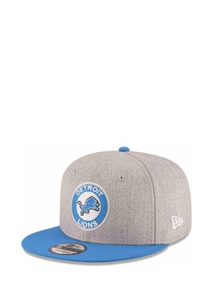 Gray and blue snapback cap with Detroit Lions logo patch on front and New Era logo embroidery on side.