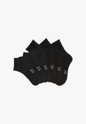 Black socks set featuring three pairs of crew socks and three pairs of ankle socks. Made of soft material with ribbed and smooth textures.