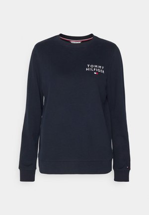 Sweatshirt bleu marine en coton. Dispose de manches longues, de bords-côtes et d'un col rond. Comprend le logo blanc "TOMMY HILFIGER" sur la poitrine.