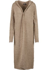 Beige hettecardigan laget av mykt, fluffy garn. Har en lang, åpen front og lange ermer, med en teksturert, lodden overflate.