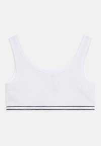 Hvid bomulds-bralette med rund hals og brede stropper. Har en sort horisontal stribebånd i bunden. Glat tekstur.