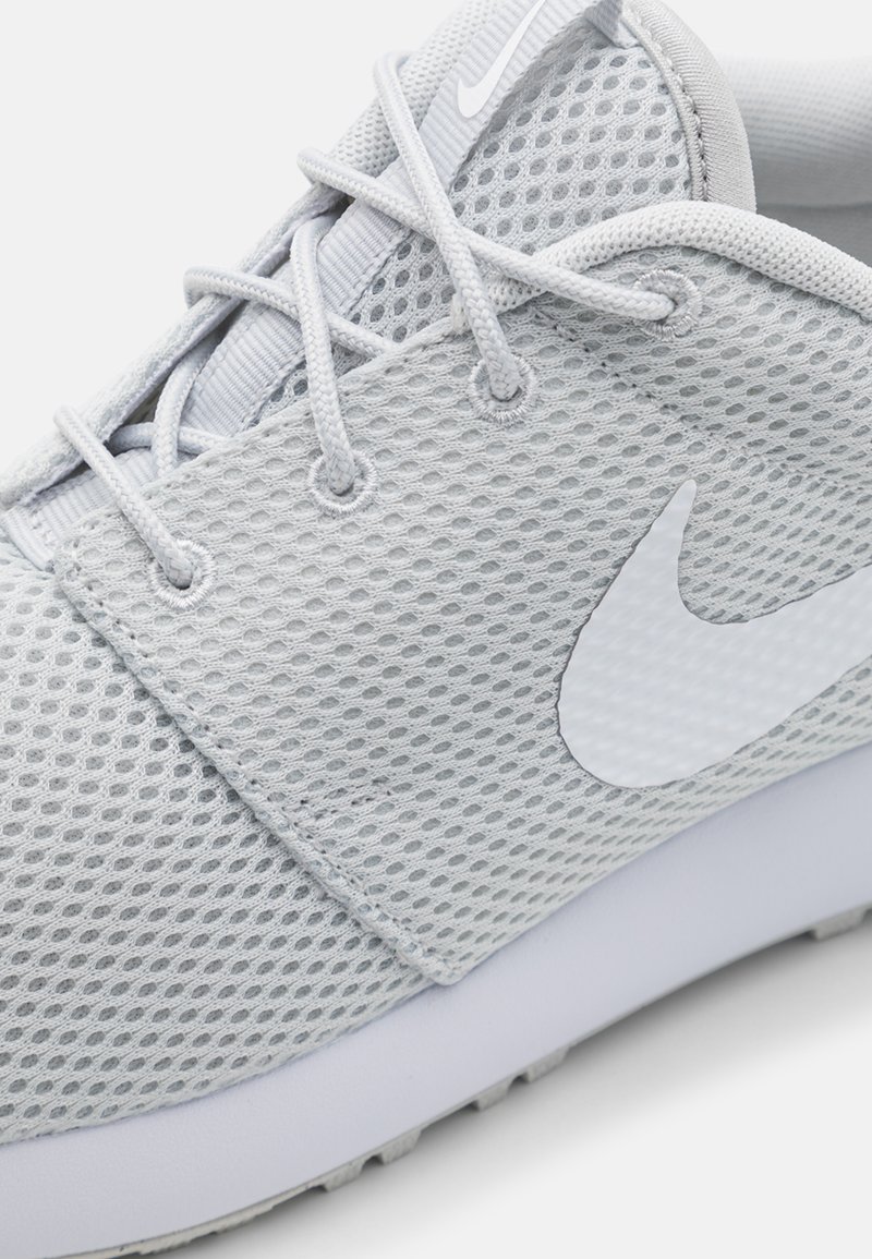 gray nike roshe