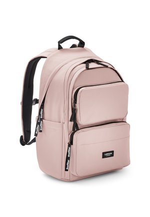Pink fabric backpack with padded shoulder straps, dual front zippered pockets, and a top carry handle. Features branding label on the front.