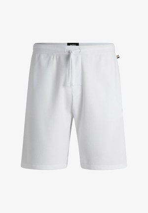 Pantaloni corti bianchi in tessuto testurizzato, con vita elastica dotata di coulisse e tasche laterali. Design semplice e pratico.